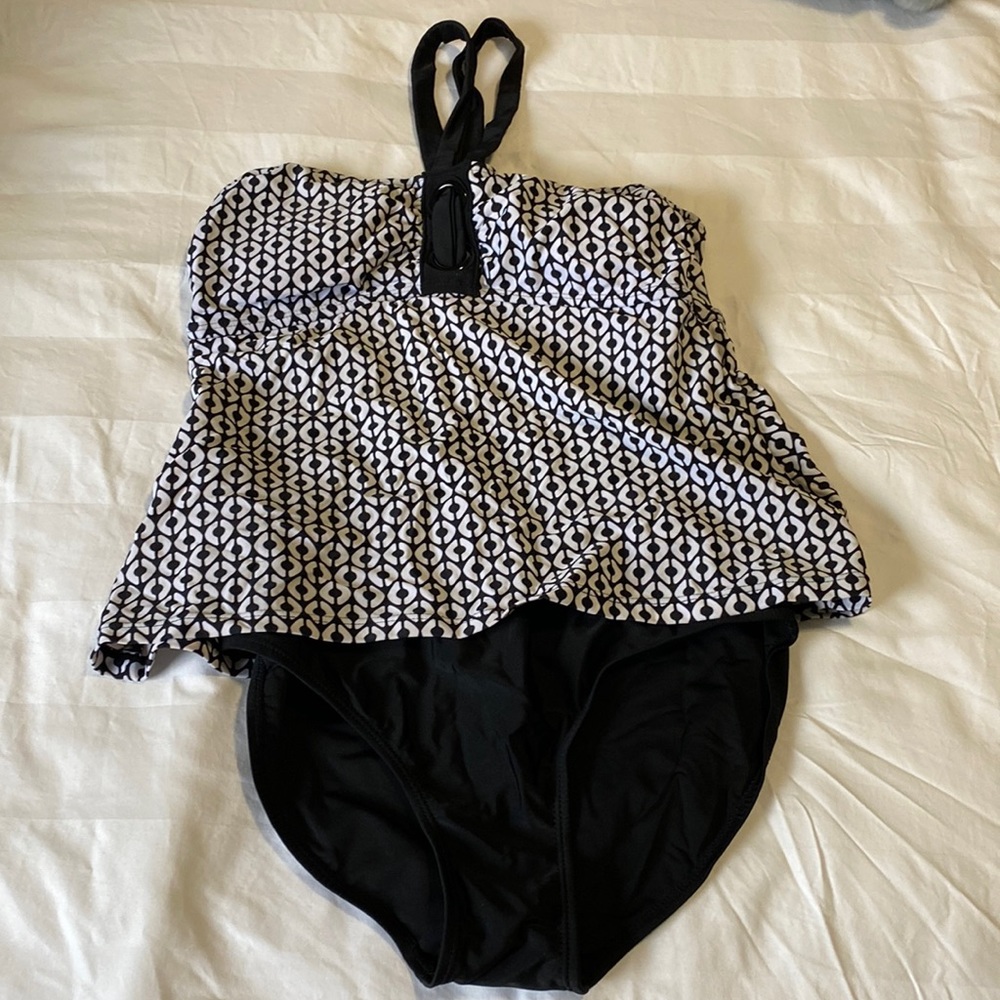 Black and white one piece swimsuit; covers the tummy-size 10